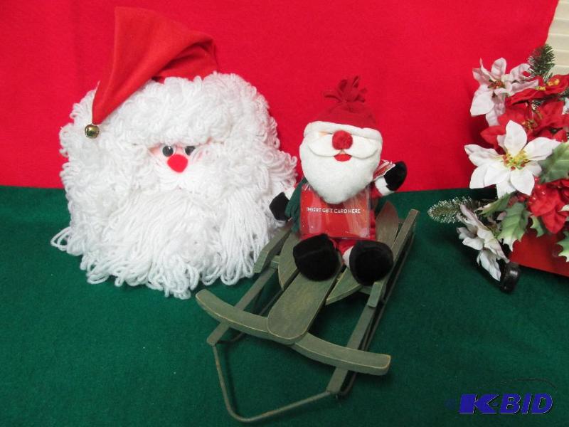 Two Santas and A Sled.