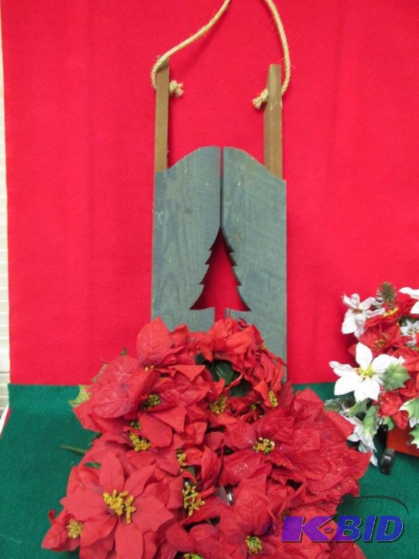 Bunch of Poinsettias  and a great Wooden Sled with a Tree Cutout