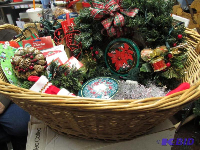 A Large Group of Christmas Items in a Big Basket.