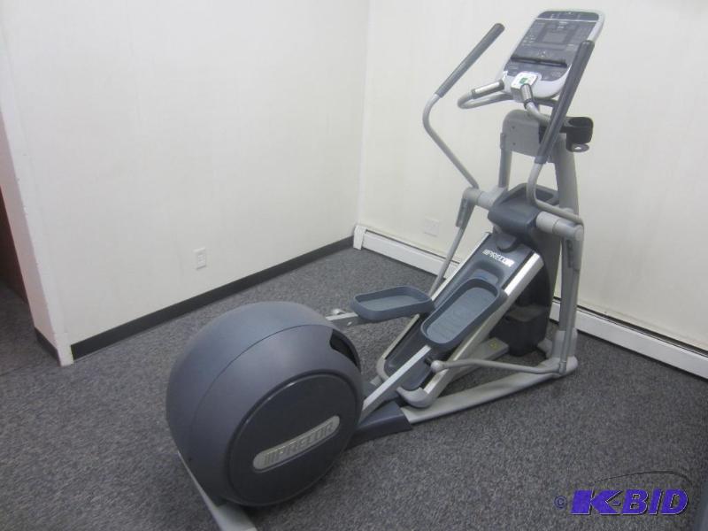 lot 10 image: Precor 576i Commercial Elliptical.  Power Incline ramp and moving arms.