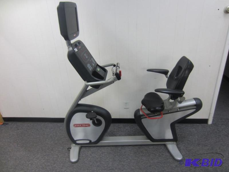 lot 25 image: Star Trac Commercial Grade Step thru Recumbant Bike.  W matching Star Trac TV package.
