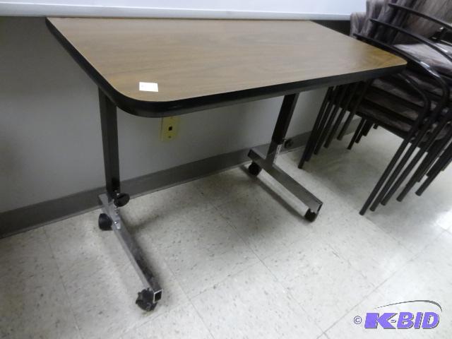 lot 65 image: Adjustable Height Table on Wheels 36 X 20...