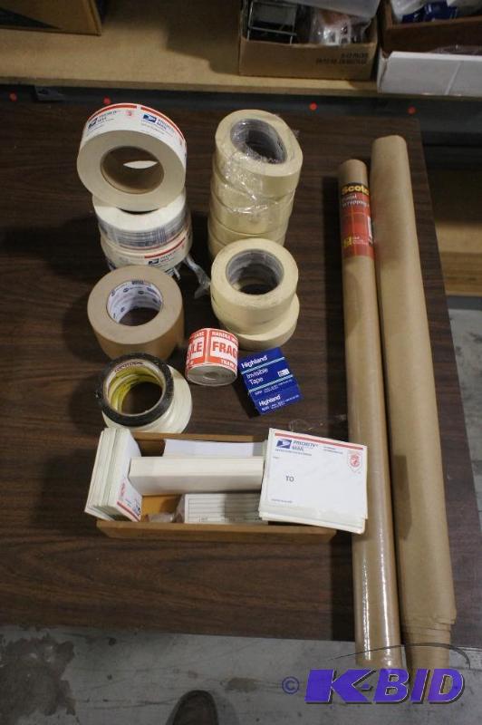 Lot of packing tape and wrapping paper for sh...