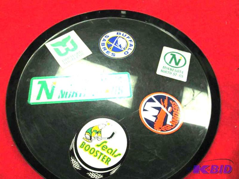 lot 1 image: Green serving tray that has stickers of Seals...