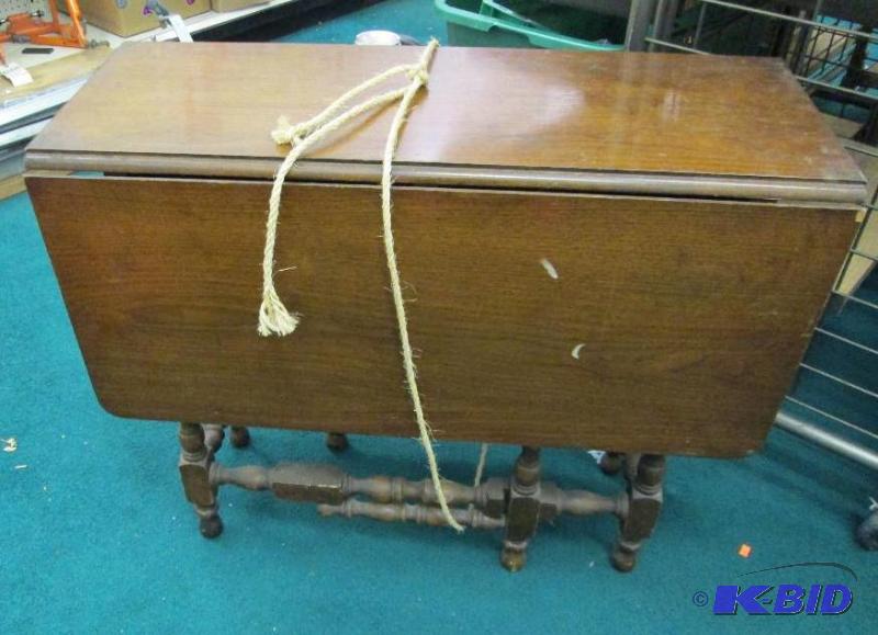 lot 204 image: Brown table that sides fold down...