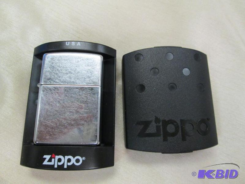 lot 217 image: Silver Zippo lighter never been used...