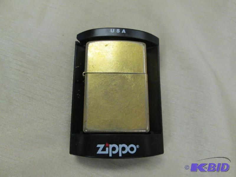 lot 218 image: Gold Zippo lighter been used...