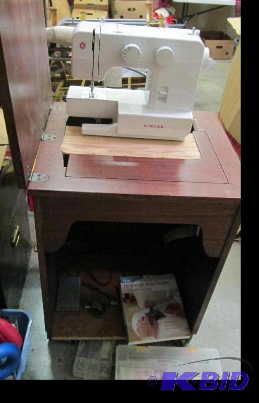 lot 230 image: Singer sewing machine it stores in shelf...