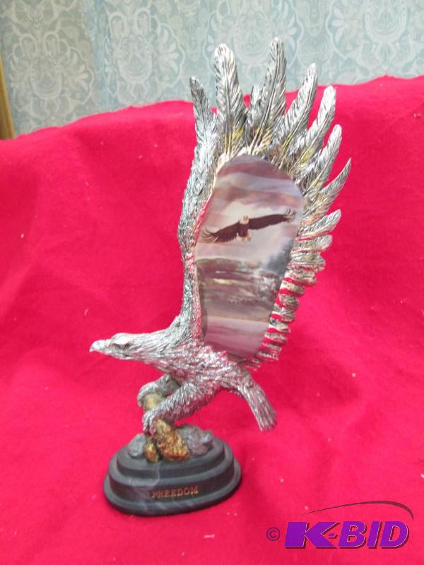 lot 52 image: A Eagle with picture on the wings on side is ...