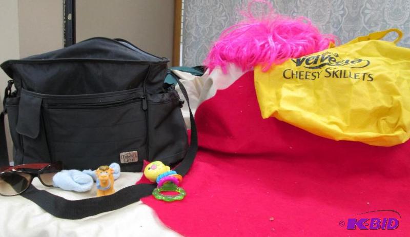 lot 95 image: Baby bag, some toys, socks, and more...