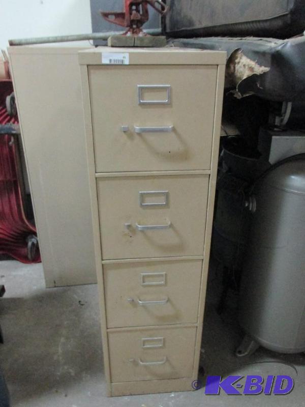 4 drawer file cabinet with parts catalogs...