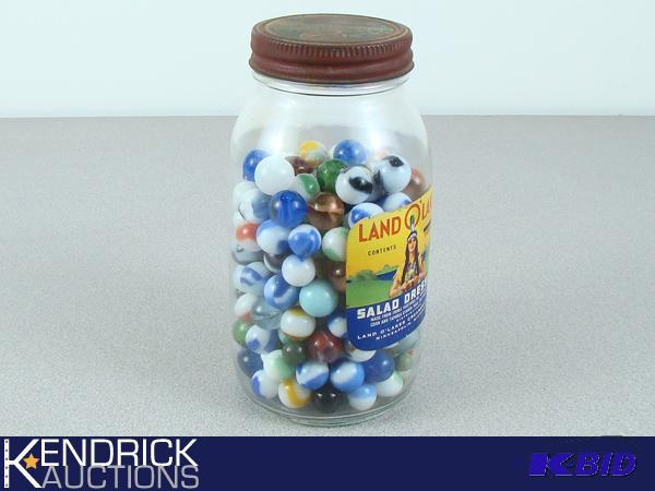 Lot of Marbles in Vintage Land O Lakes Glass Jar