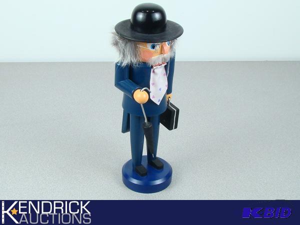 Original Erzgebirge Nutcracker of Man in Suit, and Necktie Holding Umbrella, and Suitcase