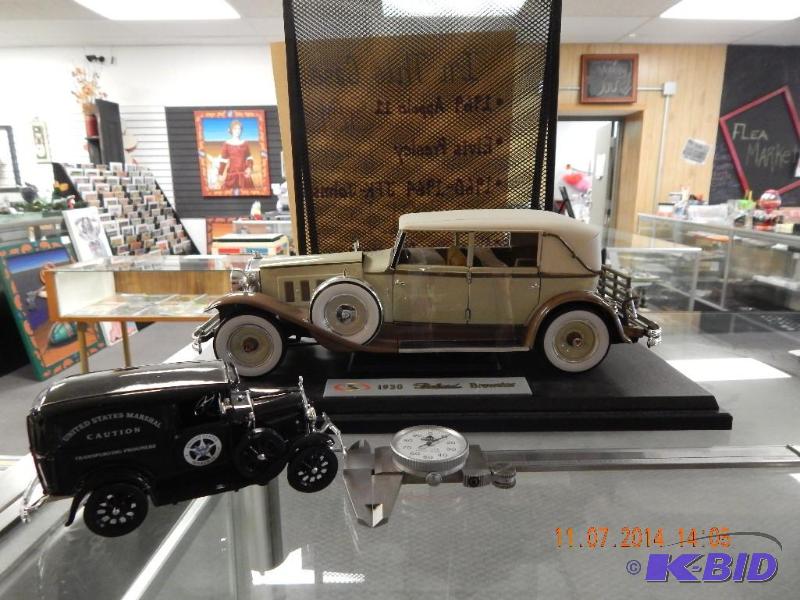 lot 22 image: diecast cars and micrometer