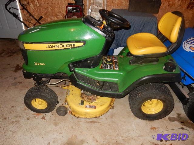 lot 9 image: John Deere 300x Lawnmower with 36in mower dec...
