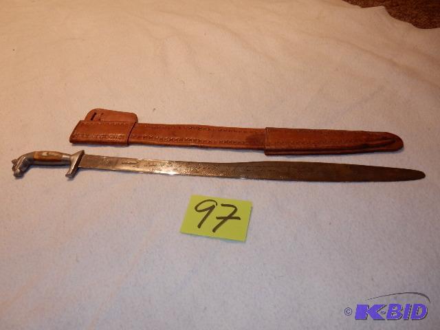 lot 97 image: Sword with leather sheath.. Has quartz like h...