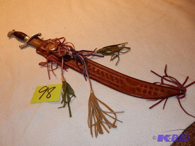 lot 98 image: Sword wleather sheath with tassles.. Made in...