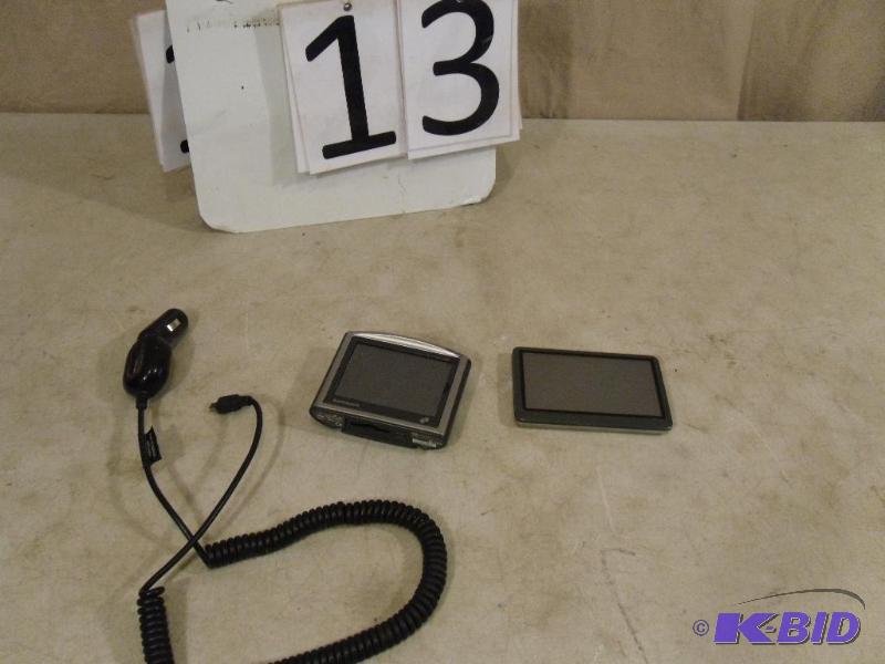 lot 13 image: 2 GPSs. Tom Tom Powers Up when Plugged In. B...