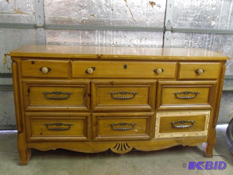 lot 138 image: Wood 9 Drawer Dresser. Missing one drawer fro...