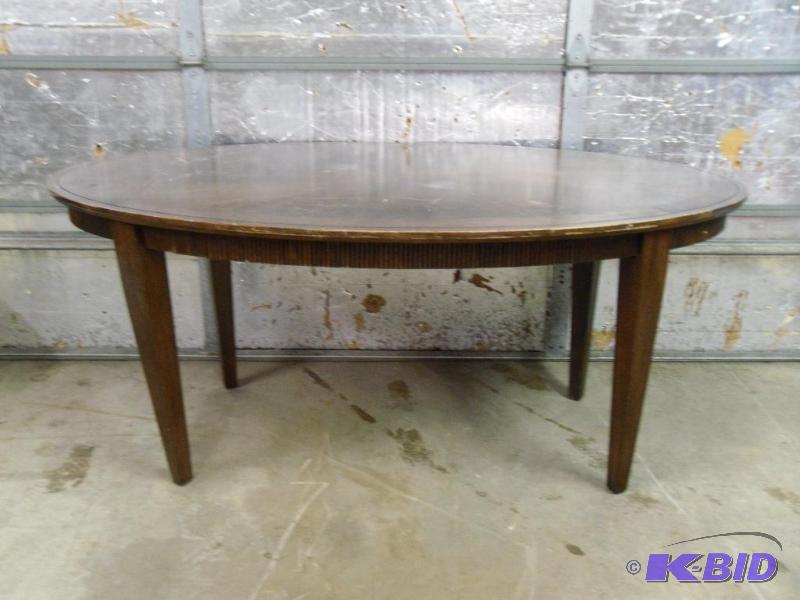 lot 142 image: Large Wood Oval Kitchen Table. Measures appro...