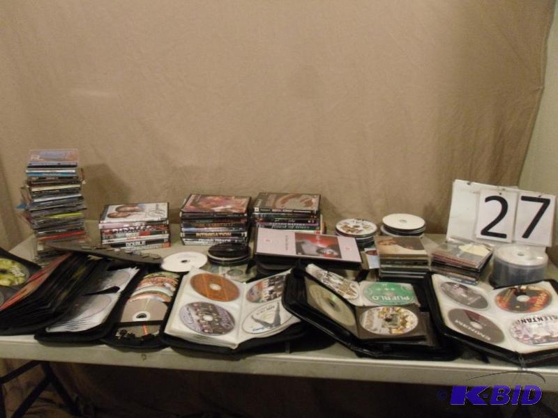 lot 27 image: Large Lot of Assorted DVDs and CDs. Most case...