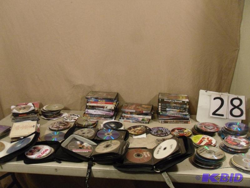 lot 28 image: Large Lot of Assorted DVDs and CDs. Most case...
