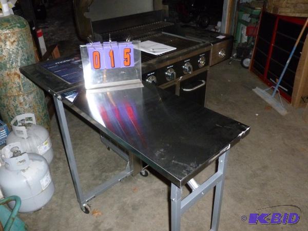 lot 15 image: Stainless Kenmore 4 burner gas grill with sid...