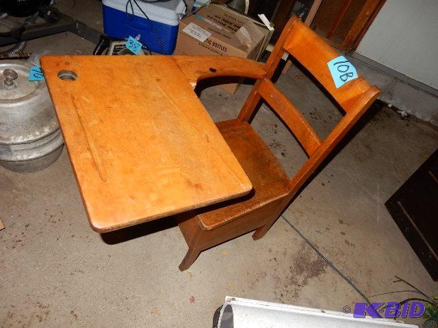 Solid wood. old school desk.. Has ink well an...