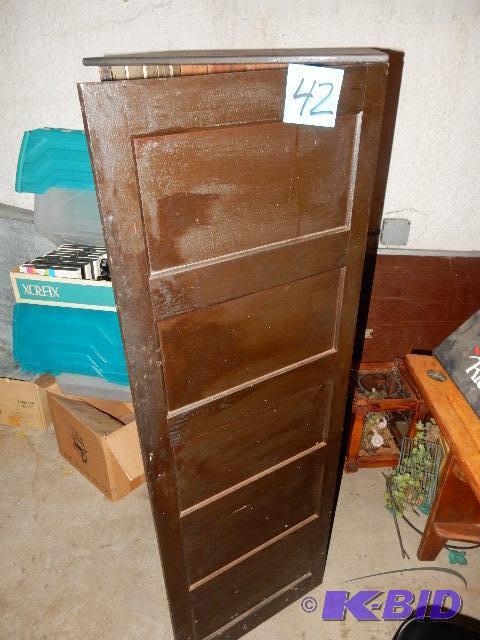 Nice wooden cabinet with paneled front and si...