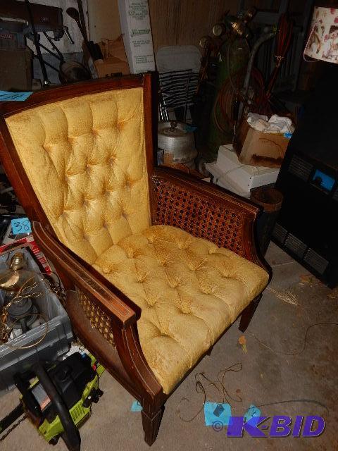 Wood and upholstered high back chair.. Has ca...