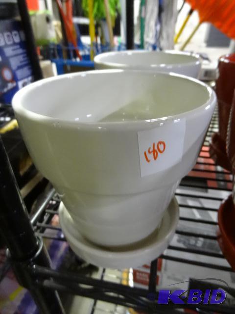 New lot of 2 ceramic planters. 6 inch with wh...