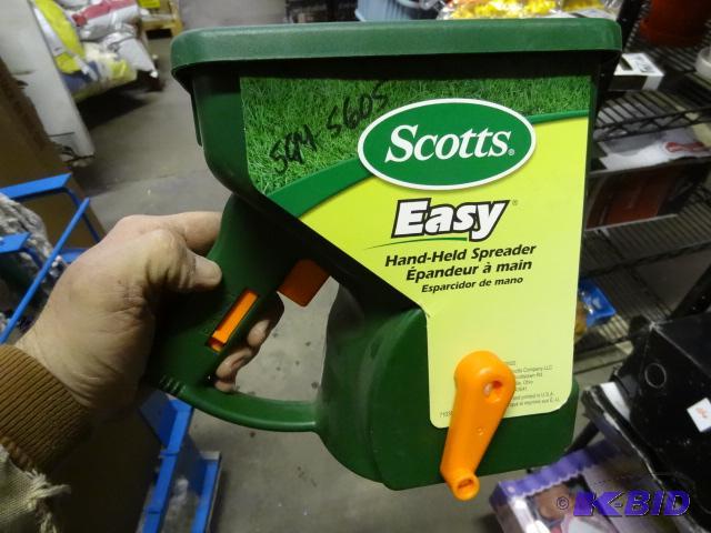 New Scotts brand easy hand-held spreader . Ti...