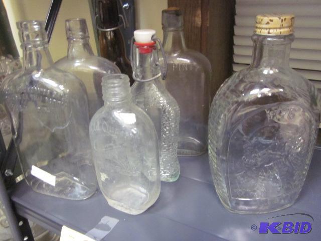 Lot of vintage glass bottles, including West ...