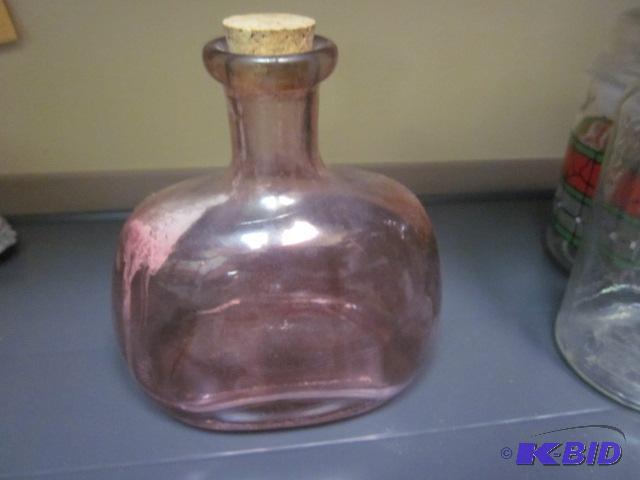Antique purple hand blown glass bottle with c...