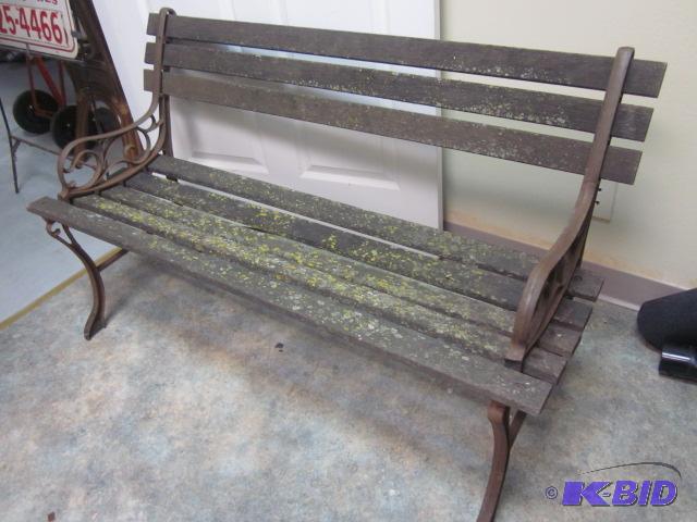 4 foot wood and cast iron outdoor bench, worn...