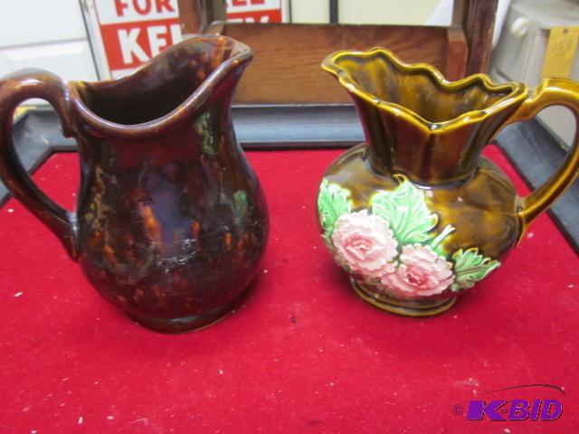 Lot of (2) ceramic pitchers, (1) with chip, o...