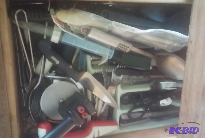 Drawer full of kitchen utensils, as shown in ...