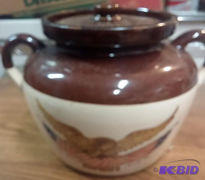 Brown crock with a replication of an eagle, n...