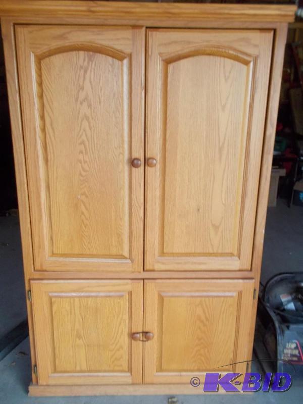 Oak Entertainment Center with closing doors....