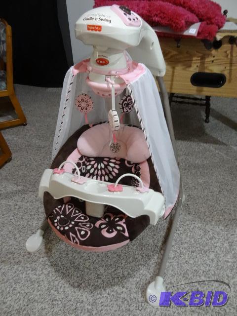 lot 21 image: Fisher Price Cradle N Swing, Works. Missing A...