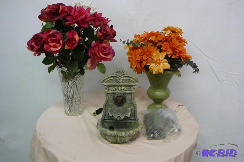 Fountain with rocks and 2 vases with flowers&...