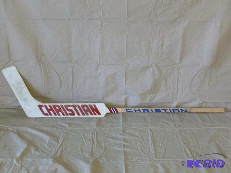 lot 113 image: Christian wooden hockey goalie stick that mea...