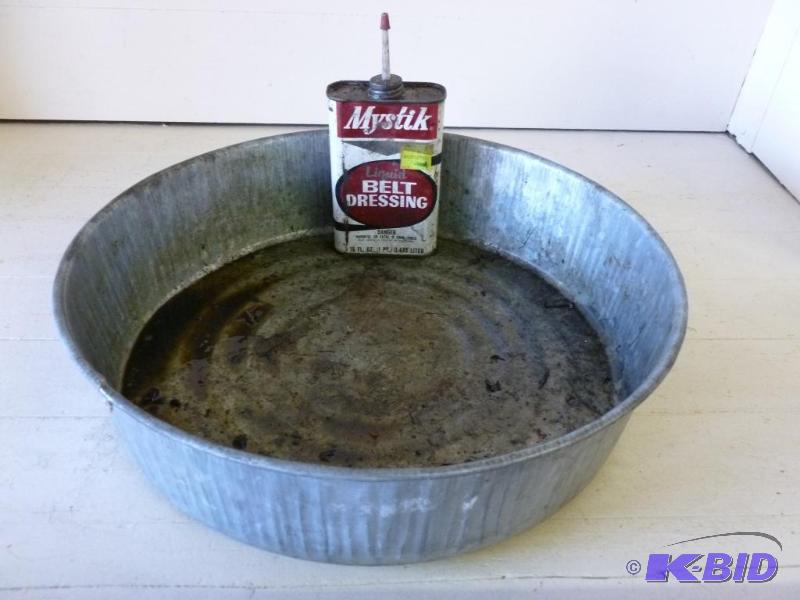 lot 131 image: Large galvanized steel oil pan and a can of b...