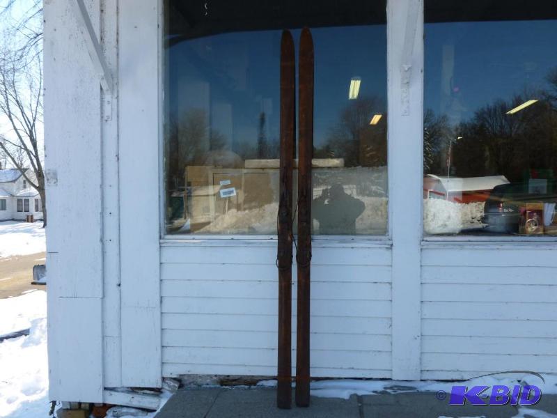 lot 7 image: A pair of large vintage wooden down hill skis...