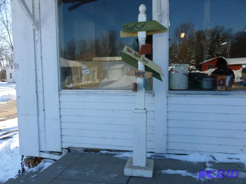 lot 8 image: Large wooden directional sign post stand that...