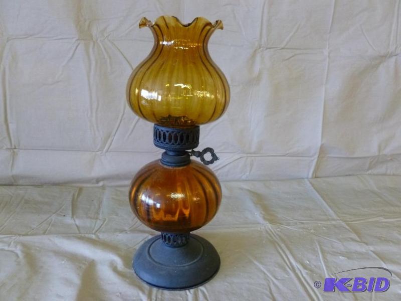 lot 83 image: Large glass and metal base oil lamp that meas...