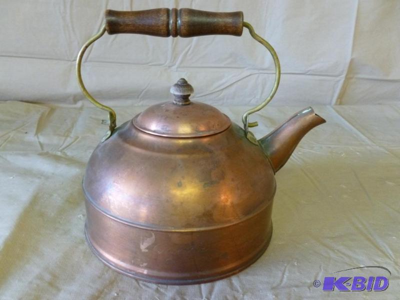 lot 84 image: Wood handled copper tea pot that measures 7 1...