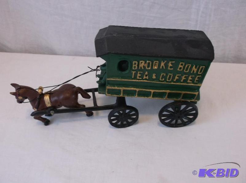 lot 13 image: Brooke Bond Tea & Coffee cast iron toy me...