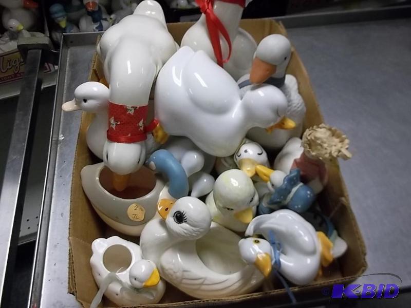 lot of ceramic geese and ducks