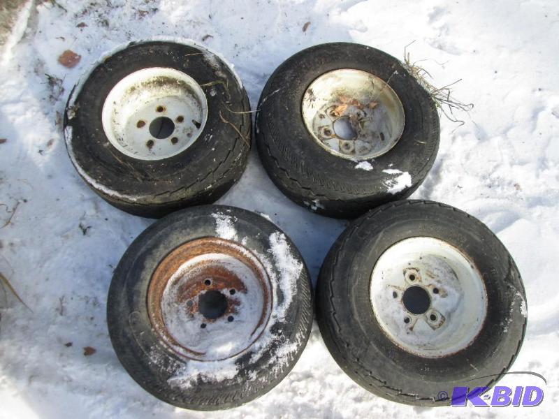lot 27 image: Rims with mounted 20.5x8.0-10 trailer tires...